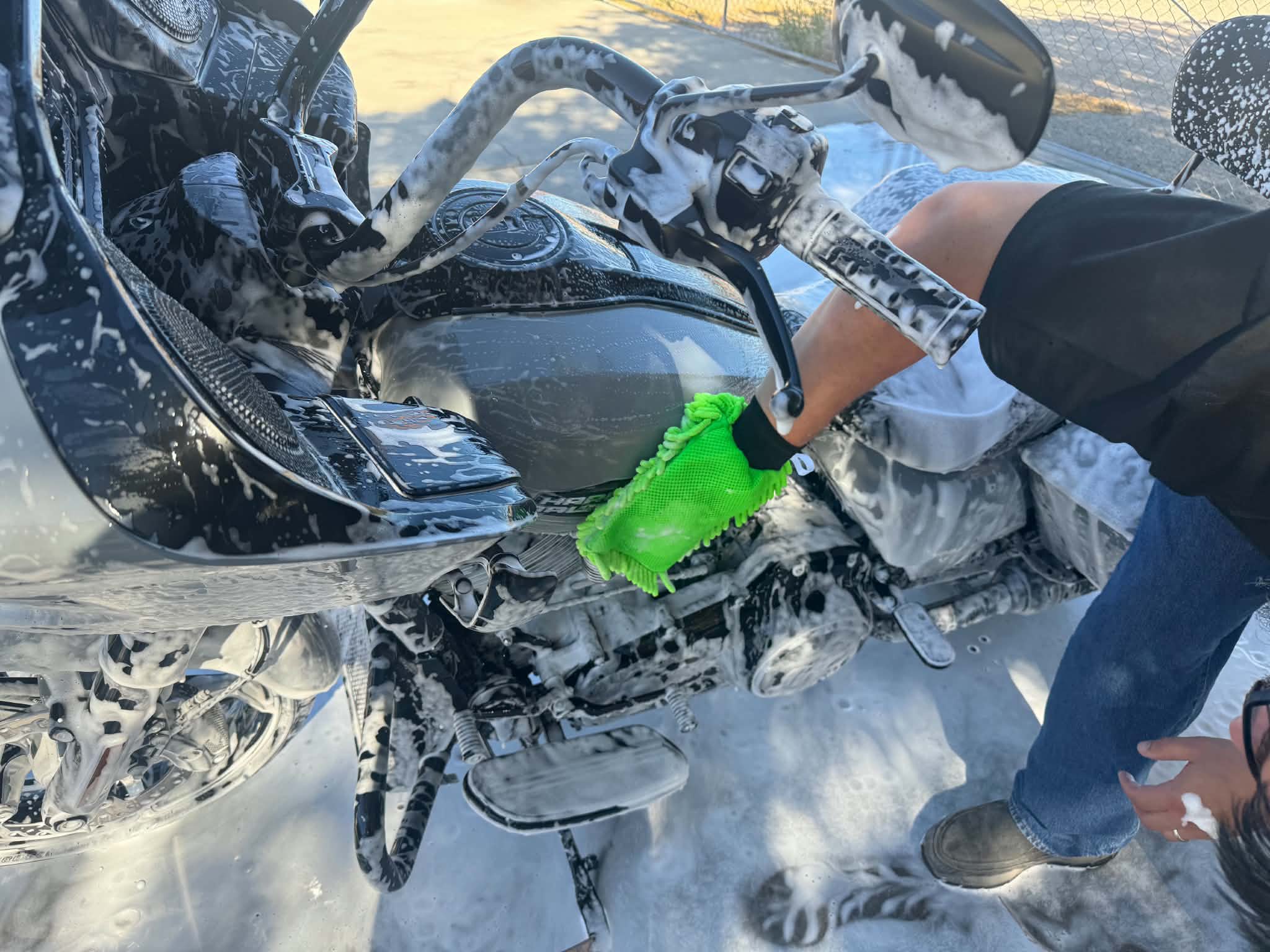 Thick foam covering a vehicle during a maintenance hand wash